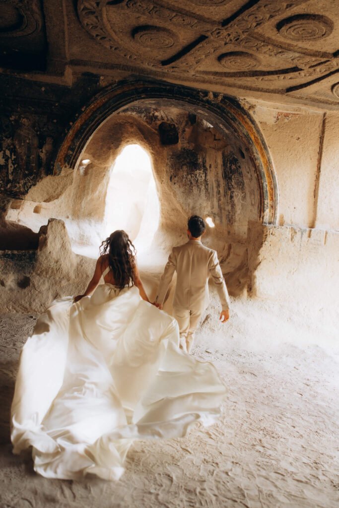 Flying dress photoshoot in a cave in Cappadocia, Turkiye
