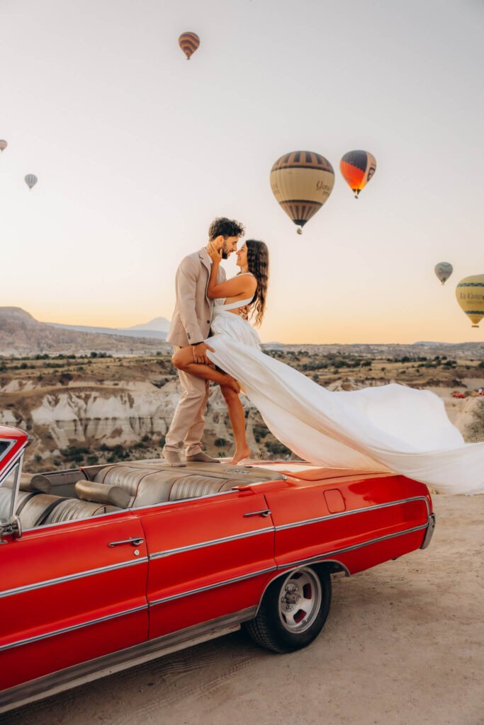 Flying dress photoshoot with a classic car in Cappadocia, Turkiye