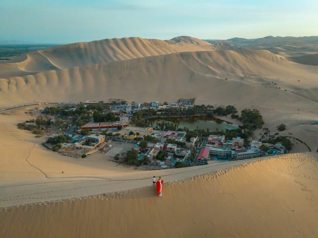 Flying dress photoshoot at Huacachina Oasis in Peru
