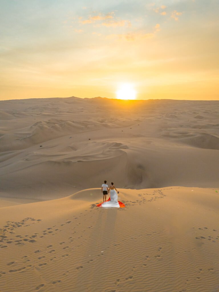 Flying dress photoshoot at Huacachina Oasis in Peru