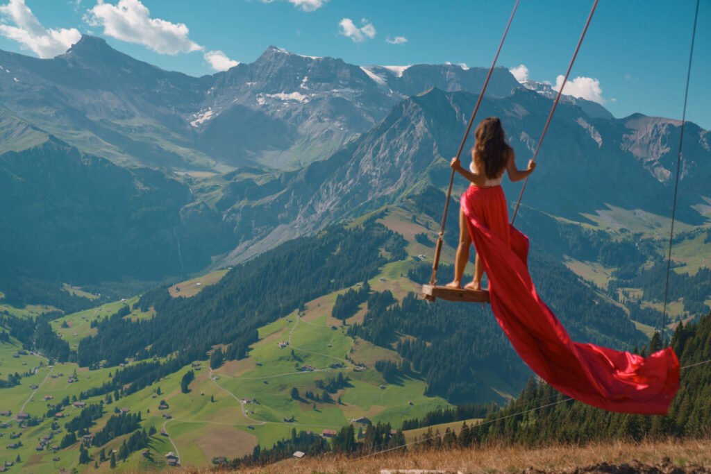 Flying dress photoshoot on a swing in Switzerland