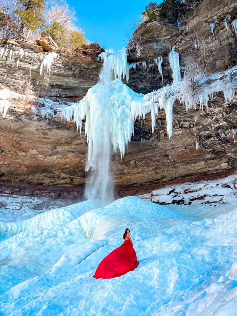 Flying dress photoshoot at a frozen waterfall in New York