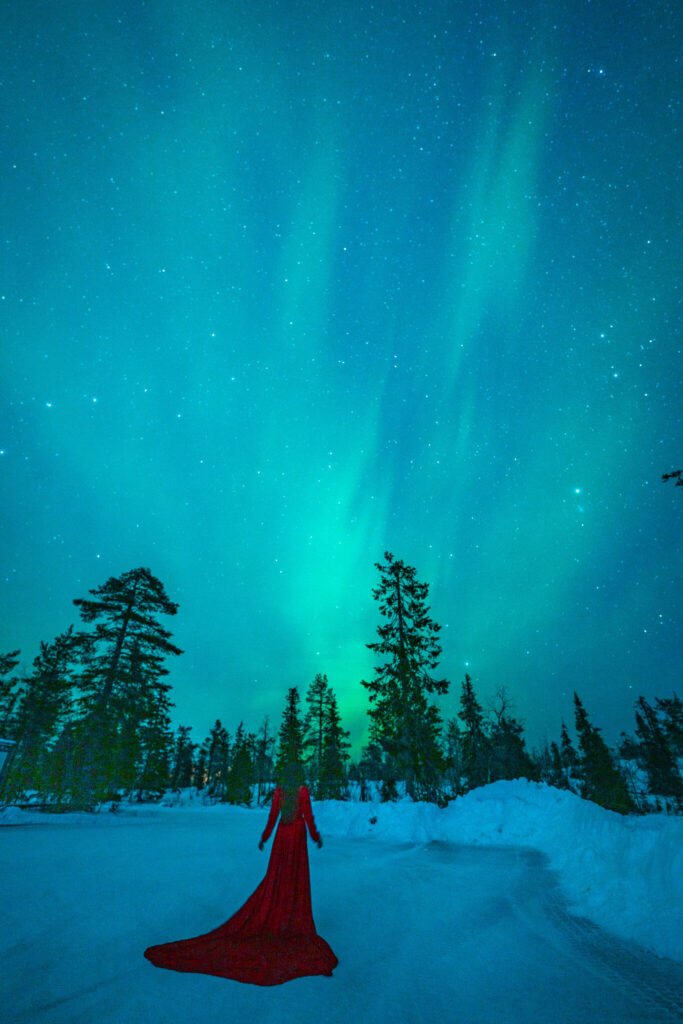 Flying dress photoshoot with the Northern Lights in Lapland, Finland