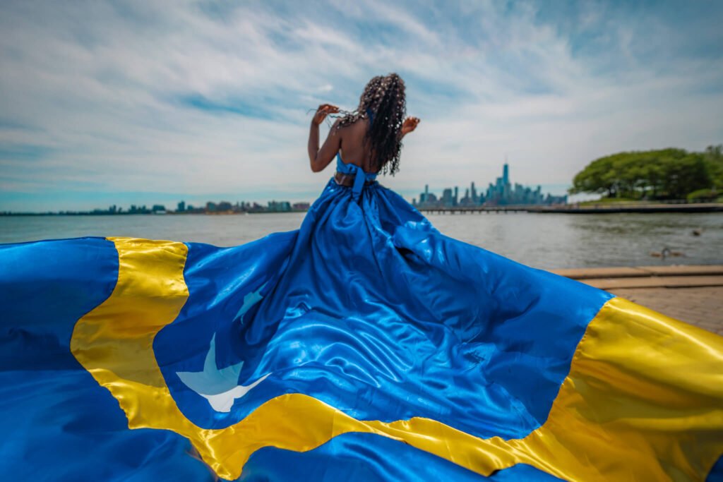 Curacao World Cup flag flying dress photoshoot in front of the NYC skyline