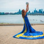 girl in a Sweden flag flying dress by Flying Dresses New York