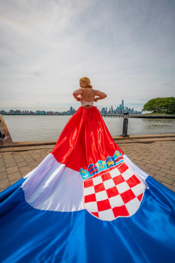girl in a Croatia flag flying dress in front of the NYC skyline