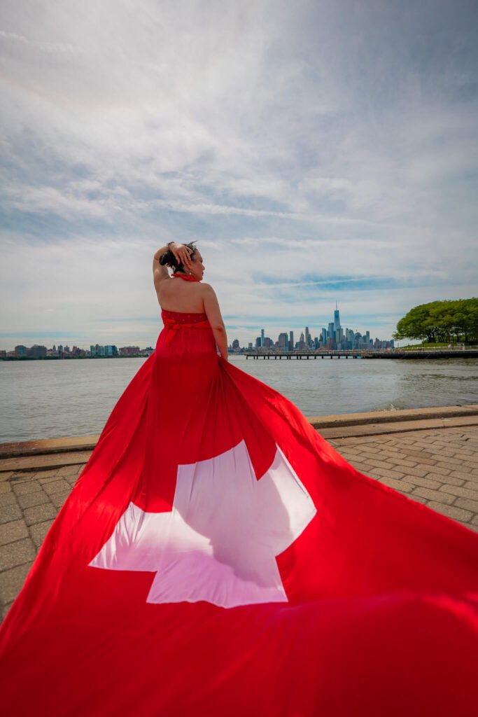 girl in a Swtizerland flag flying dress by Flying Dresses New York