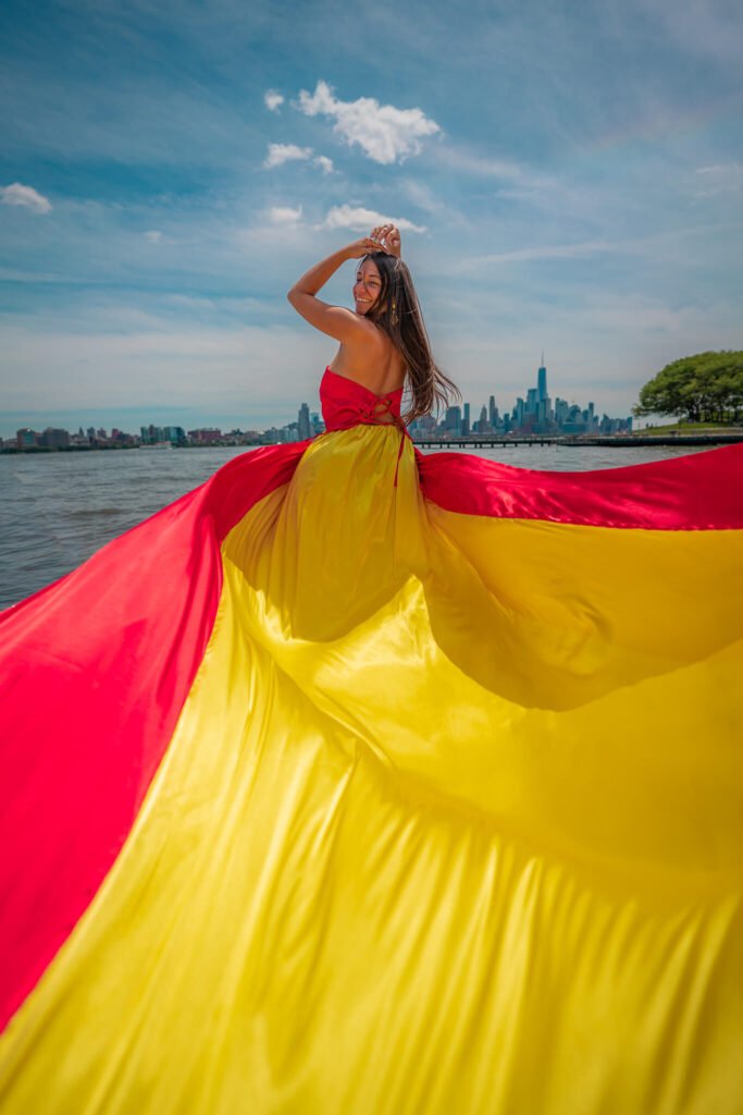girl in a Spain flag flying dress by Flying Dresses New York
