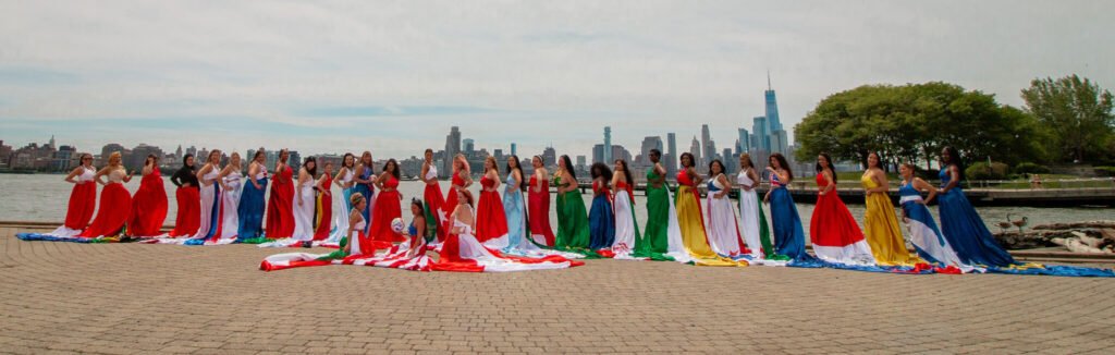 Group shot for the World Cup event with women in flag flying dresses