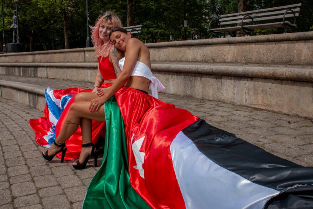 Jordan and Norway of the World Cup flag flying dress photoshoot in front of the NYC skyline
