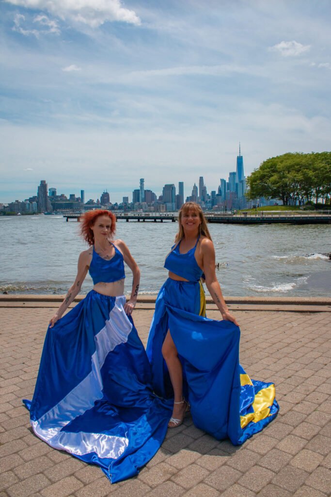 Scotland and Sweden flying dress photoshoot in front of the NYC skyline in Hoboken, NJ