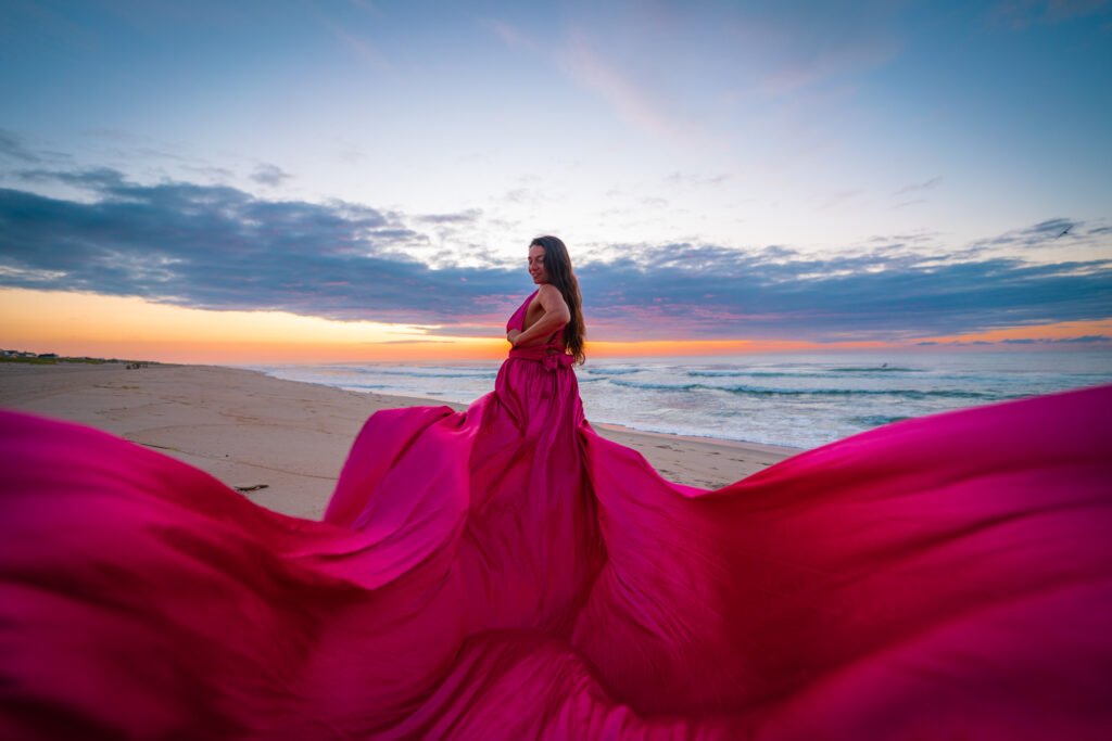 hot pink flying dress photoshoot in LBI, New Jersey at sunrise