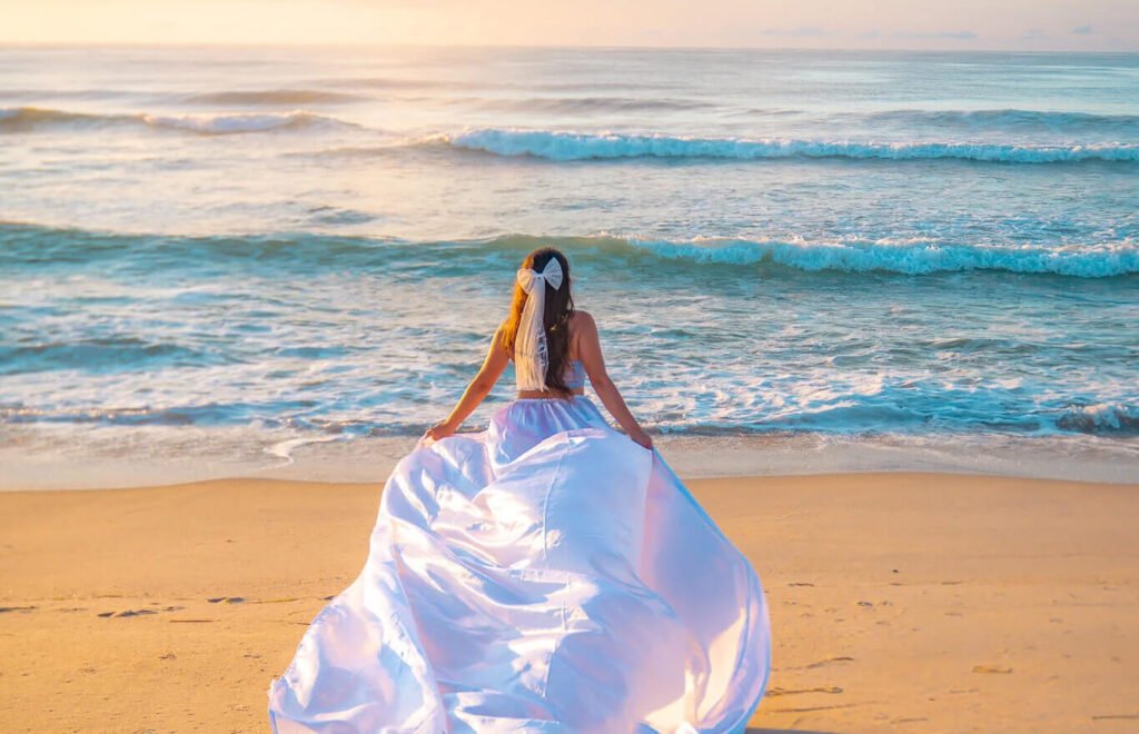 Jersey shore photoshoot at sunrise in a bride to be flying dress