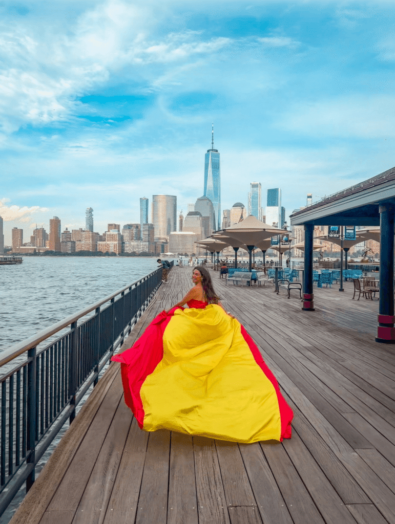 Girl in a Spanish flag flying dress at Exchange Place in New Jersey