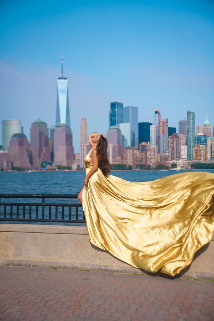 girl in a hot pink flying dress in Liberty State Park, New Jersey