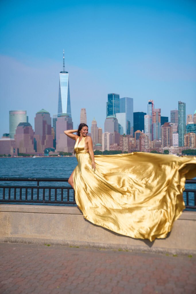 girl in a hot pink flying dress in Liberty State Park, New Jersey